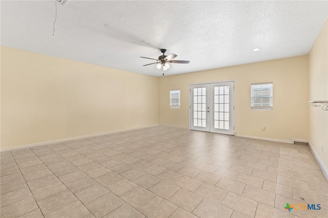 709 Aries Ave, Killeen, TX 76542 - spare room with a ceiling fan, plenty of natural light, a textured ceiling, baseboards, and french doors