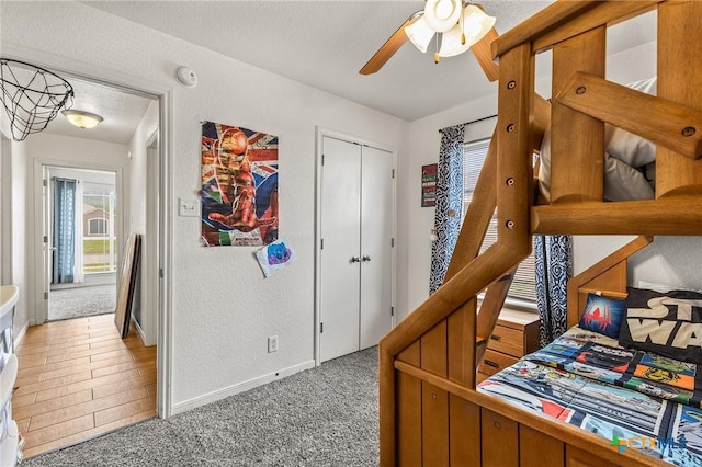 709 Aries Ave, Killeen, TX 76542 - bedroom with multiple windows, light carpet, baseboards, and ceiling fan