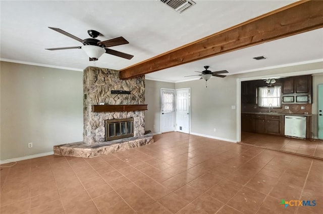 3106 Bobolink St, Victoria, TX 77901 - unfurnished living room with ceiling fan, tile patterned flooring, a fireplace, crown molding, and beam ceiling