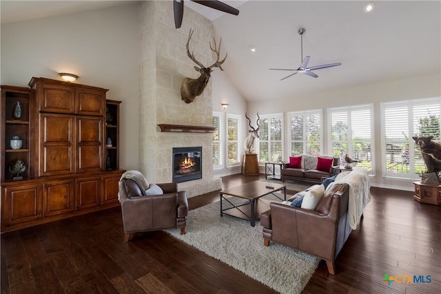 1280 Mystic Pkwy, Spring Branch, TX 78070 - living room featuring a ceiling fan, high vaulted ceiling, dark wood-type flooring, a tile fireplace, and recessed lighting