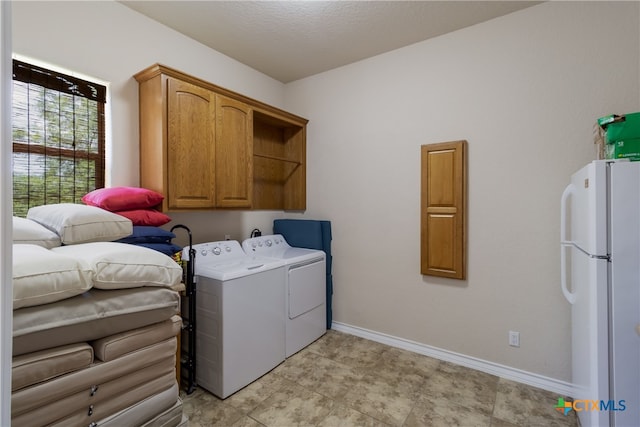 1280 Mystic Pkwy, Spring Branch, TX 78070 - laundry room with washing machine and clothes dryer and cabinet space
