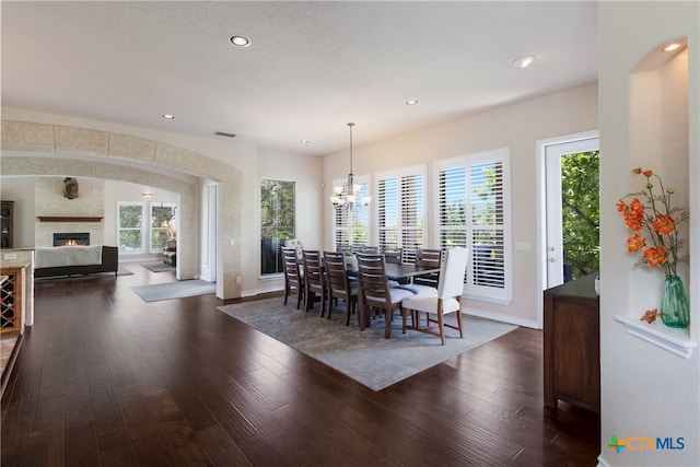 1280 Mystic Pkwy, Spring Branch, TX 78070 - dining space featuring dark wood-style flooring, a fireplace, a chandelier, and recessed lighting
