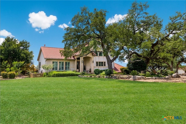 1280 Mystic Pkwy, Spring Branch, TX 78070 - view of front of home featuring a front lawn, stucco siding, and a tiled roof