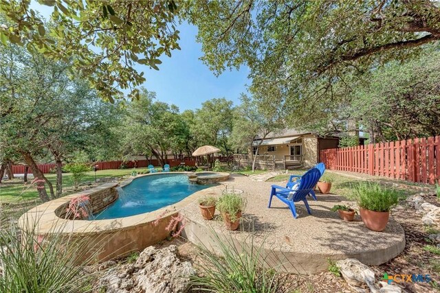 133 Ridgewood Cv, Georgetown, TX 78633 - view of swimming pool with a patio and a pool with connected hot tub