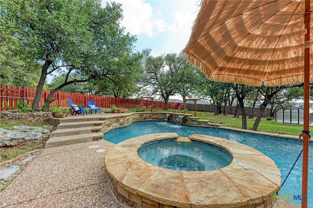 133 Ridgewood Cv, Georgetown, TX 78633 - view of swimming pool with a pool with connected hot tub