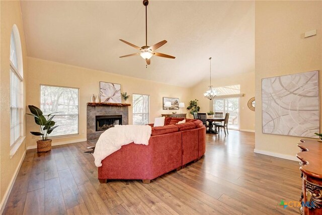 133 Ridgewood Cv, Georgetown, TX 78633 - living area featuring ceiling fan, wood finished floors, baseboards, high vaulted ceiling, and a fireplace