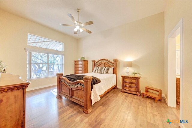 133 Ridgewood Cv, Georgetown, TX 78633 - bedroom with light wood-type flooring, baseboards, and a ceiling fan