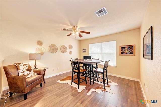 133 Ridgewood Cv, Georgetown, TX 78633 - dining space with wood finished floors, ceiling fan, and baseboards
