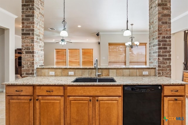 kitchen featuring sink, light stone countertops, crown molding, decorative columns, and dishwasher