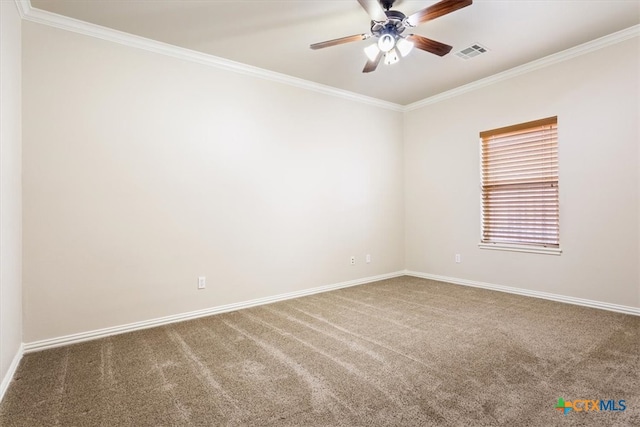 carpeted empty room featuring ceiling fan and crown molding