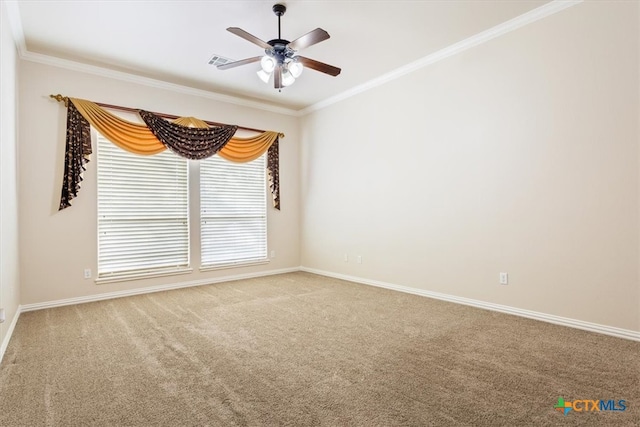 spare room featuring carpet flooring, ceiling fan, and crown molding