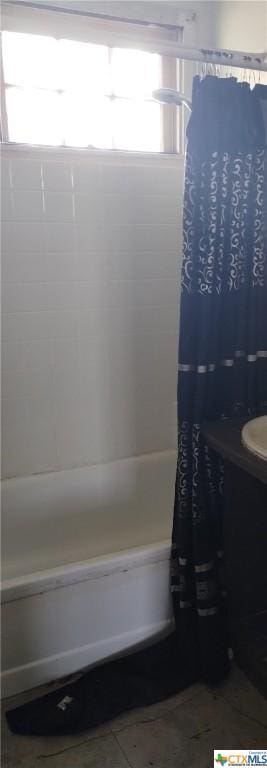 full bathroom with tile patterned floors, shower / tub combo with curtain, and vanity