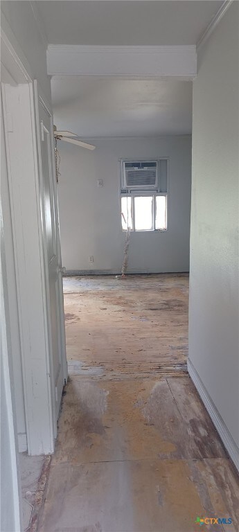 spare room featuring an AC wall unit