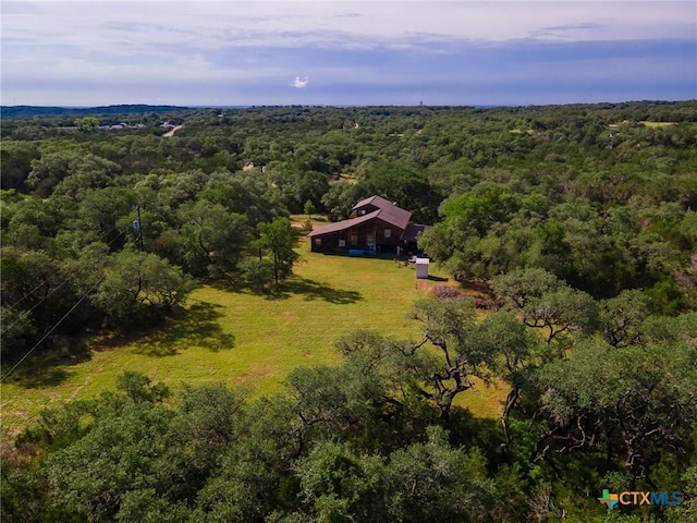 1398 Lazy Frst, New Braunfels, TX 78132 - aerial view of property and surrounding area with a heavily wooded area