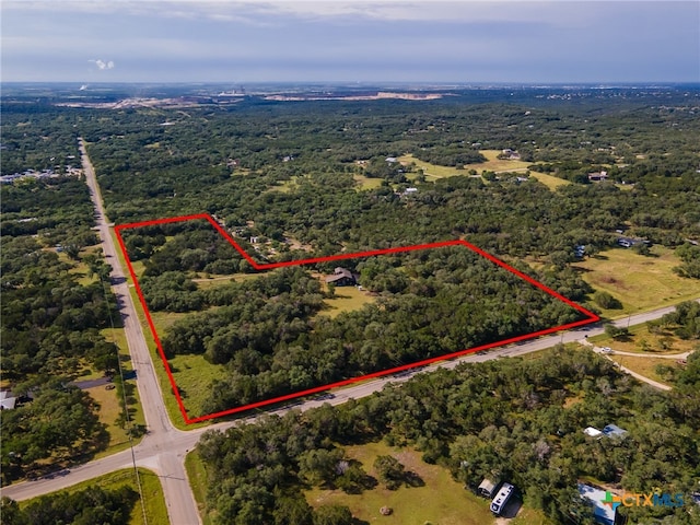 1398 Lazy Frst, New Braunfels, TX 78132 - aerial overview of property's location with a heavily wooded area and property boundaries highlighted