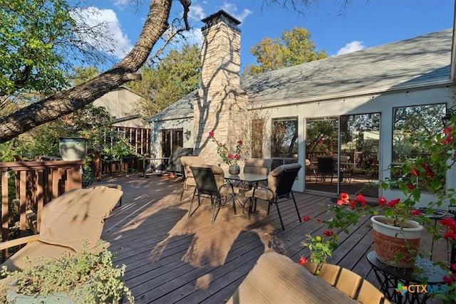 wooden deck with outdoor dining space