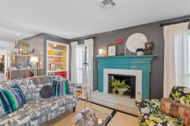6115 Country Club Dr, Victoria, TX 77904 - living area with a fireplace and crown molding