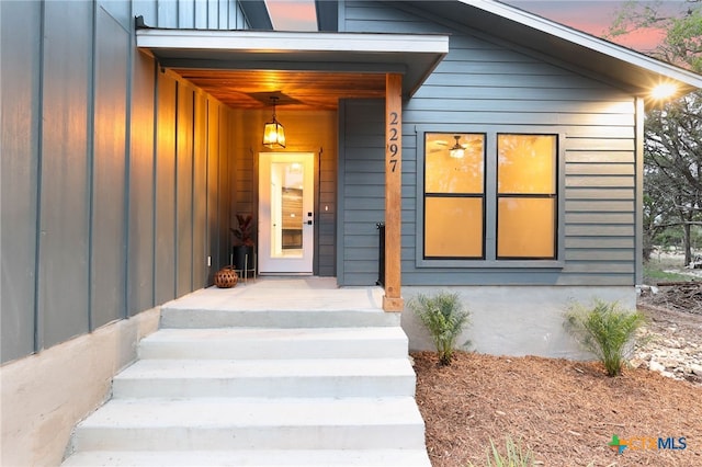 view of exterior entry at dusk