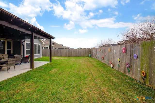 view of yard with a patio area and a fenced backyard