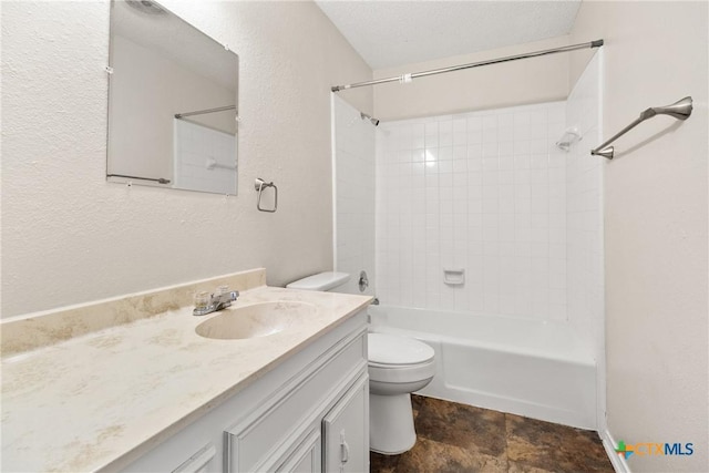 full bathroom featuring vanity,  shower combination, a textured ceiling, toilet, and a textured wall