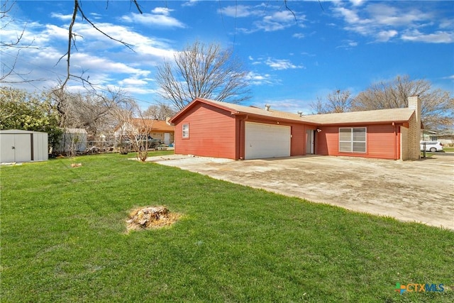 view of home's exterior with a lawn, driveway, a storage shed, an attached garage, and a chimney