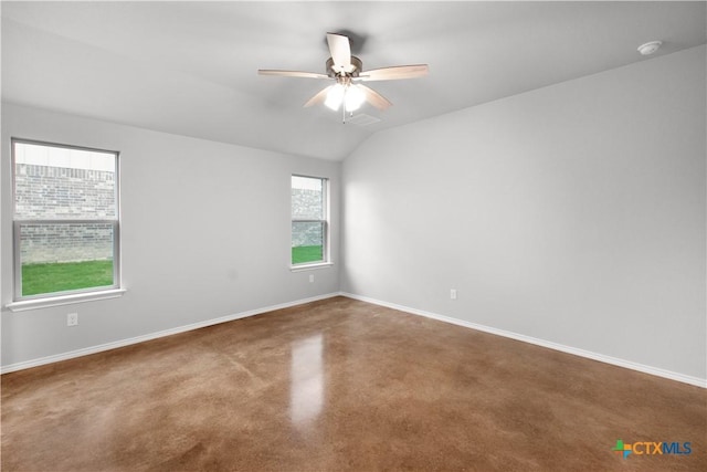 empty room featuring visible vents, baseboards, ceiling fan, and vaulted ceiling