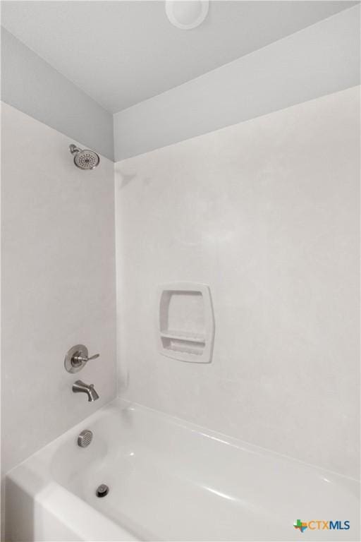 bathroom with shower / tub combination