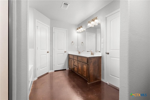 3104 Goblin Dr, Killeen, TX 76549 - bathroom featuring finished concrete flooring and double vanity