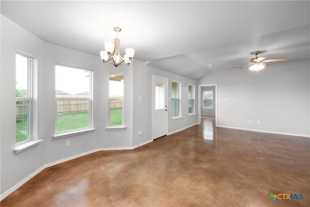 interior space with concrete floors, baseboards, vaulted ceiling, and ceiling fan with notable chandelier