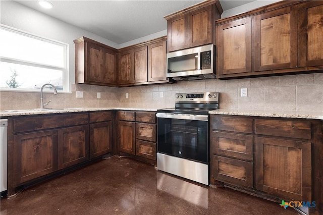 3104 Goblin Dr, Killeen, TX 76549 - kitchen with stainless steel appliances, finished concrete floors, tasteful backsplash, and light stone counters
