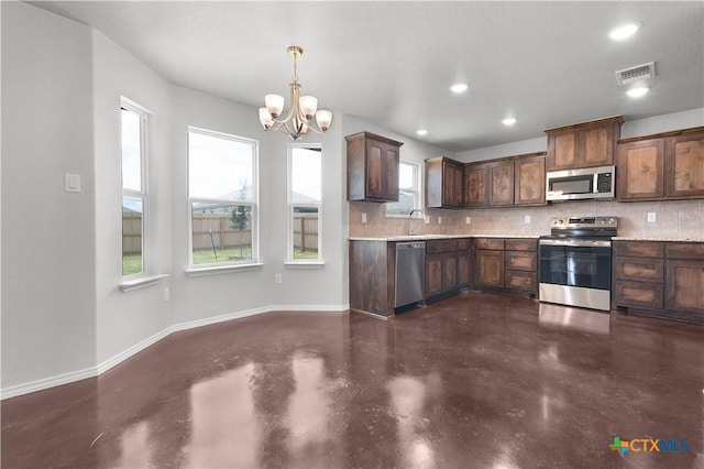 3104 Goblin Dr, Killeen, TX 76549 - kitchen with stainless steel appliances, concrete flooring, decorative backsplash, light countertops, and recessed lighting