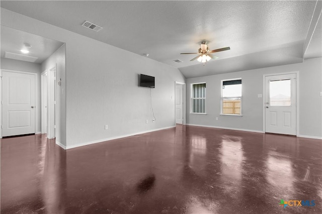 3104 Goblin Dr, Killeen, TX 76549 - unfurnished living room with finished concrete flooring, a ceiling fan, and vaulted ceiling