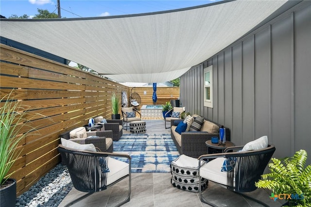 view of patio / terrace with an outdoor hangout area and a fenced backyard