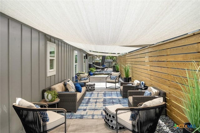 view of patio with a fenced backyard and outdoor lounge area