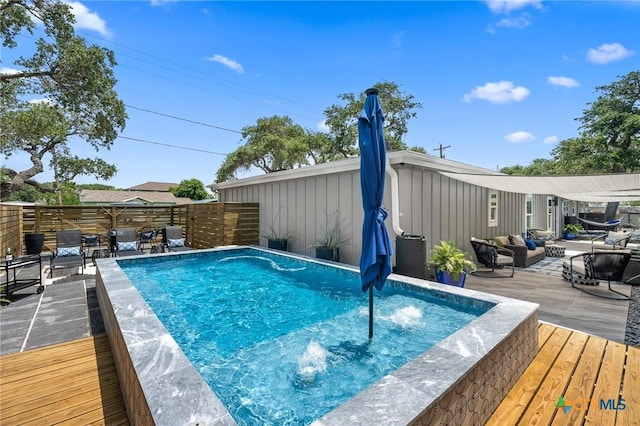 view of pool featuring an outdoor hangout area, a patio area, a fenced in pool, and a deck