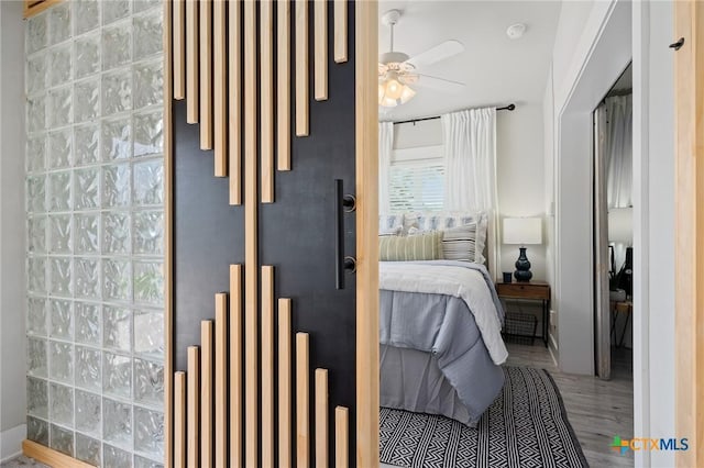 bedroom with wood finished floors