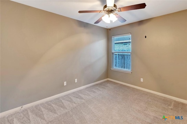 unfurnished room with light carpet and ceiling fan