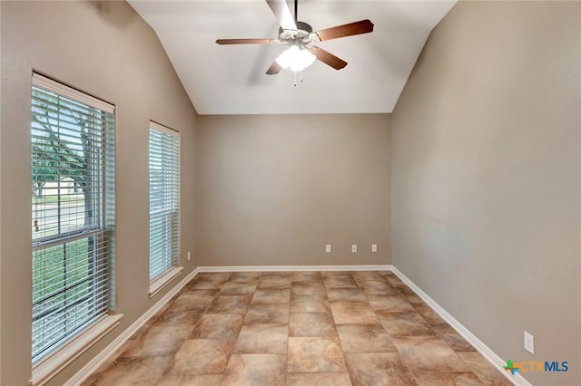 spare room featuring vaulted ceiling and ceiling fan