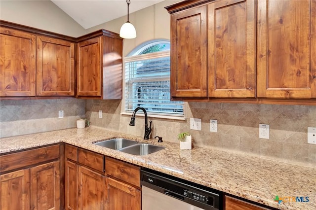 kitchen featuring lofted ceiling, sink, hanging light fixtures, stainless steel dishwasher, and light stone counters