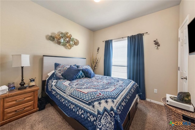 bedroom with carpet and baseboards
