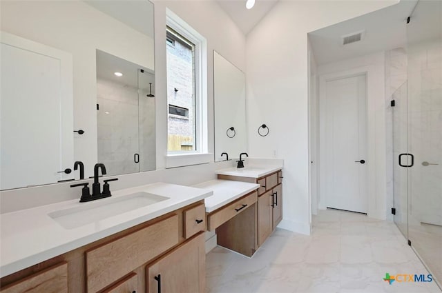 367 Five Mile Creek Way, Kyle, TX 78640 - full bath with a marble finish shower, marble look tiles, two vanities, and recessed lighting