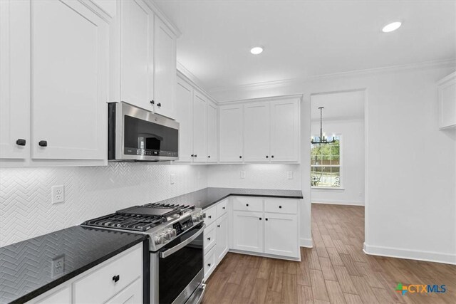 unfurnished room featuring dark wood-type flooring and ornamental molding