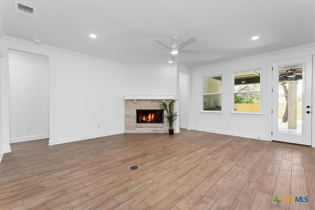 4113 Turning Leaf Dr, Nolanville, TX 76559 - unfurnished living room with a ceiling fan, ornamental molding, wood finished floors, a fireplace, and baseboards