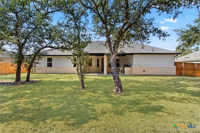 4113 Turning Leaf Dr, Nolanville, TX 76559 - back of house with stucco siding and a shingled roof