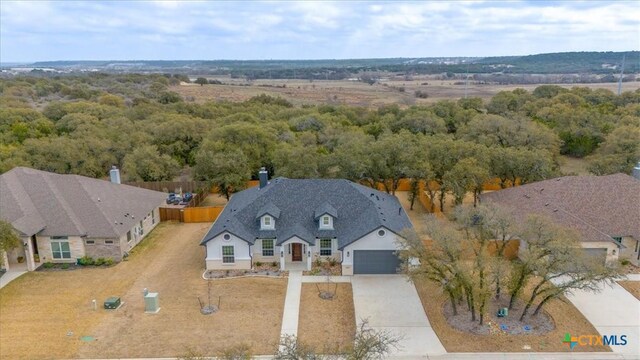 view of front of property with a garage and a front yard