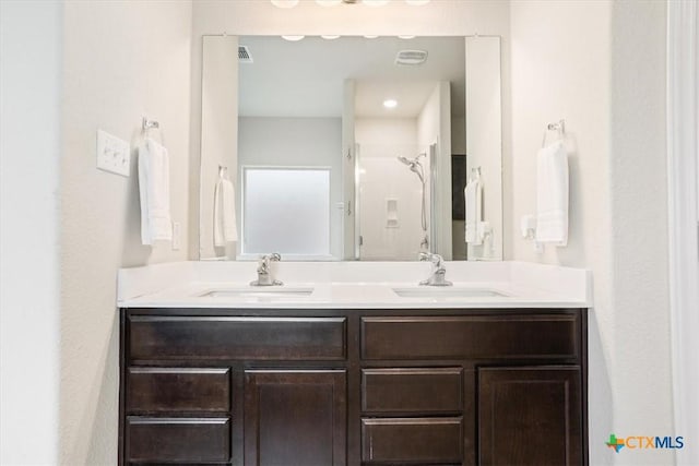 6231 Ambrose Cir, Temple, TX 76502 - bathroom with double vanity and a shower