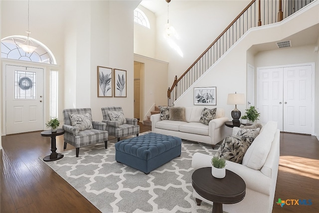 6231 Ambrose Cir, Temple, TX 76502 - living room with a high ceiling, hardwood / wood-style floors, and stairway