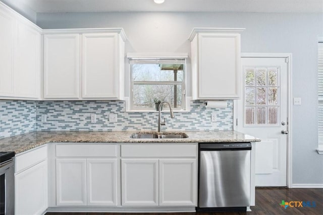 6231 Ambrose Cir, Temple, TX 76502 - kitchen featuring stainless steel dishwasher, white cabinets, tasteful backsplash, and light stone countertops