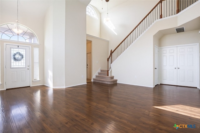 6231 Ambrose Cir, Temple, TX 76502 - entryway featuring a towering ceiling, healthy amount of natural light, wood finished floors, and stairs