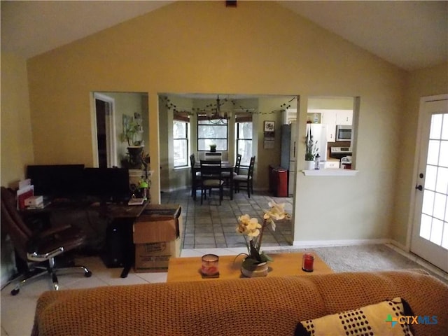 interior space featuring a wealth of natural light and vaulted ceiling